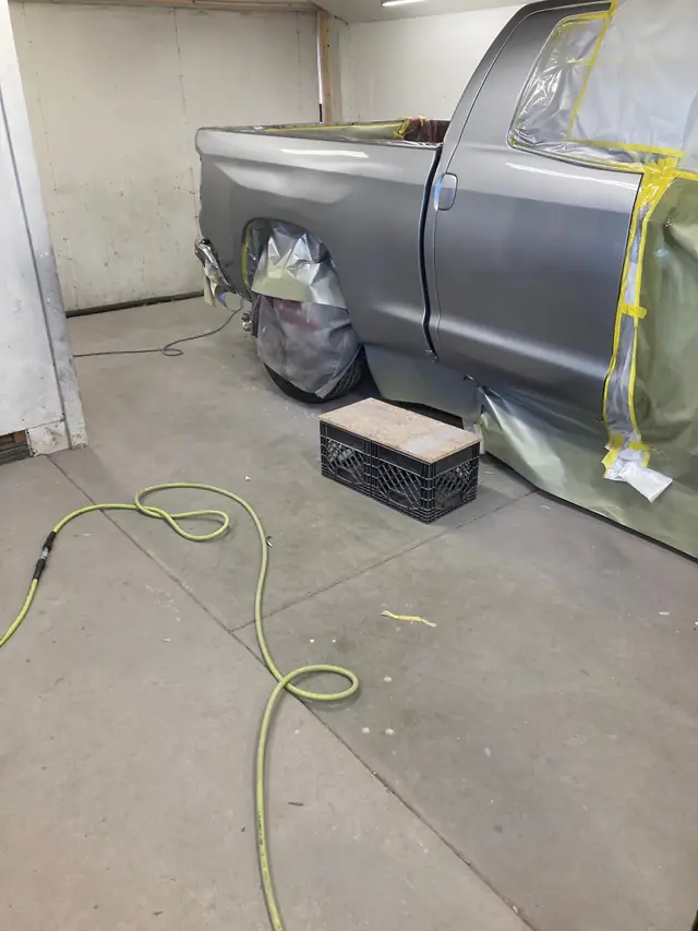 Truck masked and being refinished in the paint booth