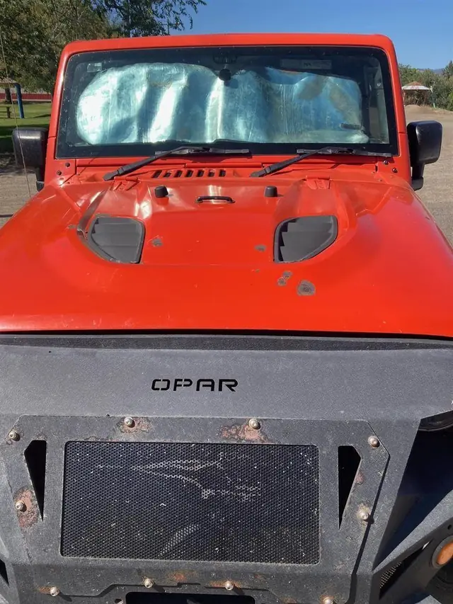 Orange Jeep hood and front bumper, finished